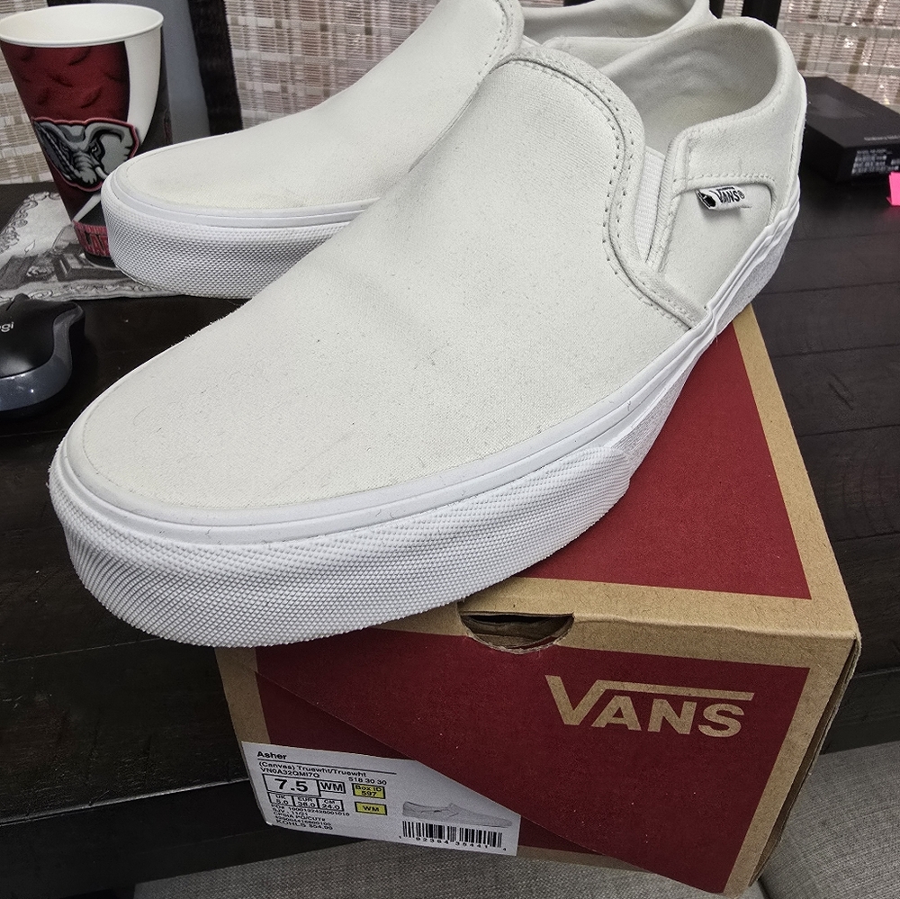 Vans white slip ons